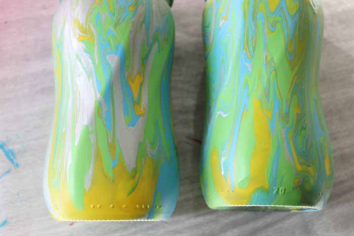 finished mason jars with acrylic pour painting decorating technique 