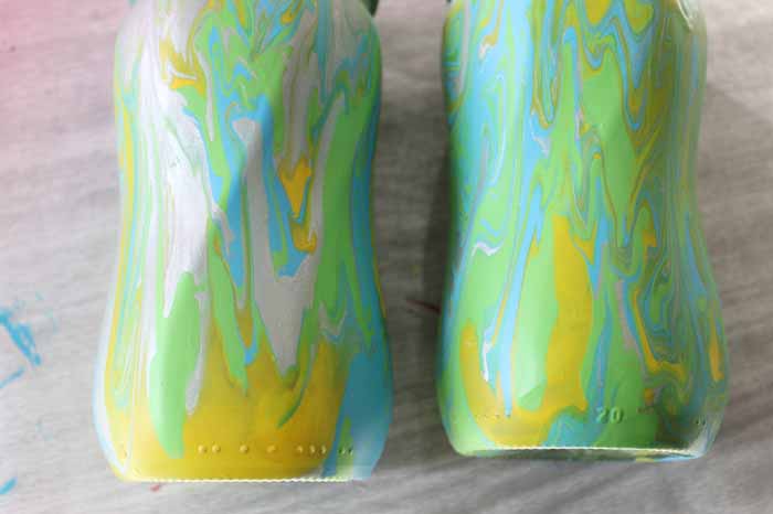 finished mason jars with acrylic pour painting decorating technique