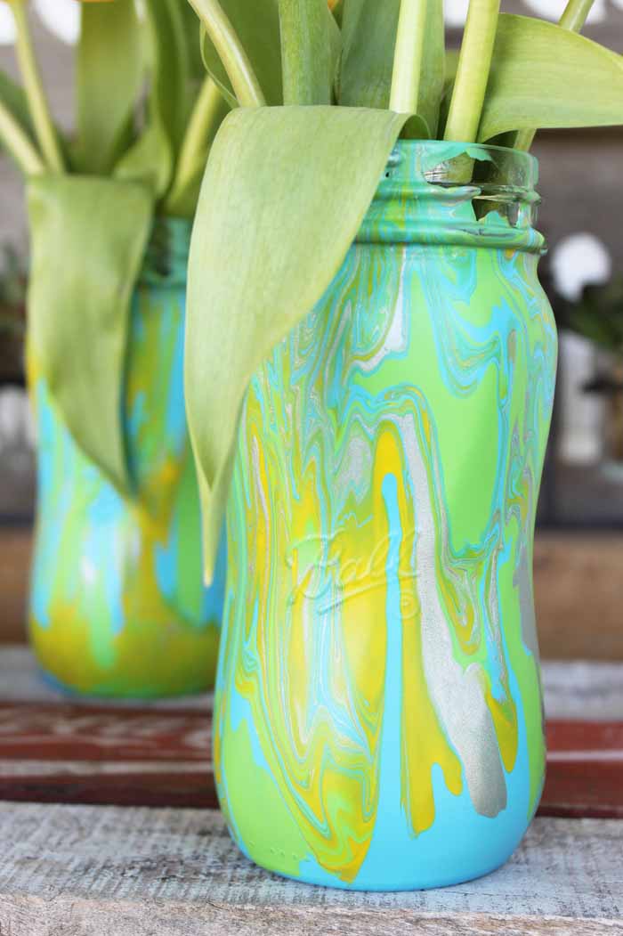 acrylic paint pouring on mason jars -finished products