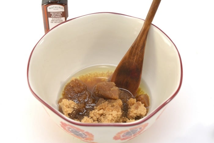 mixing brown sugar scrub in a bowl