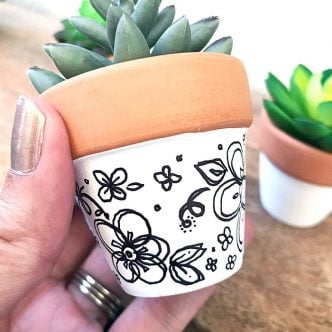 clay pot with doodles