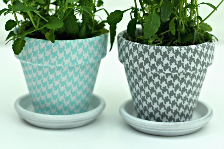 A close up of a flower pot with houndstooth pattern