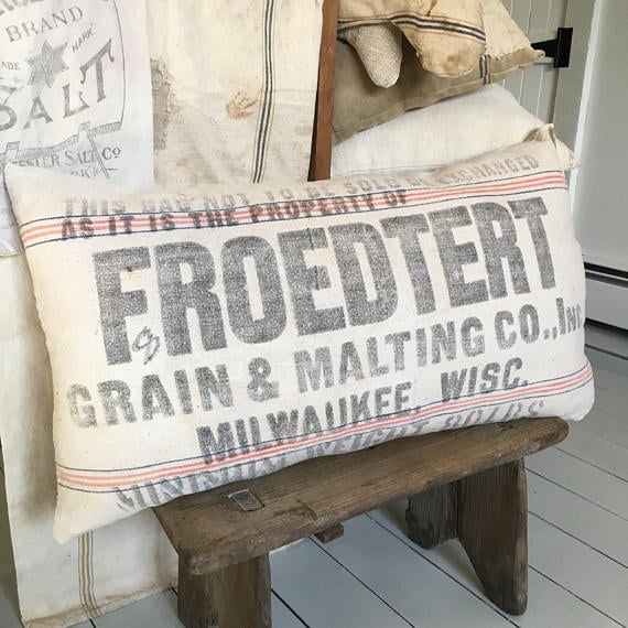 I love this vintage feed sack pillow that would go perfectly in any farmhouse or rustic style room