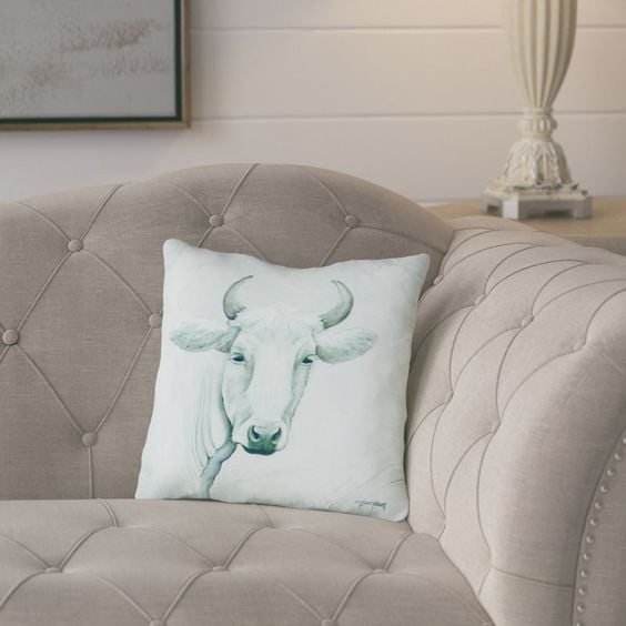 Add this adorable cow pillow to your farmhouse style living room.