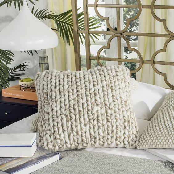 This braided throw pillow is soft and cozy, and would pair perfectly with a braided throw blanket in a farmhouse style room