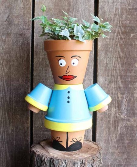 clay pot planter that looks like a person