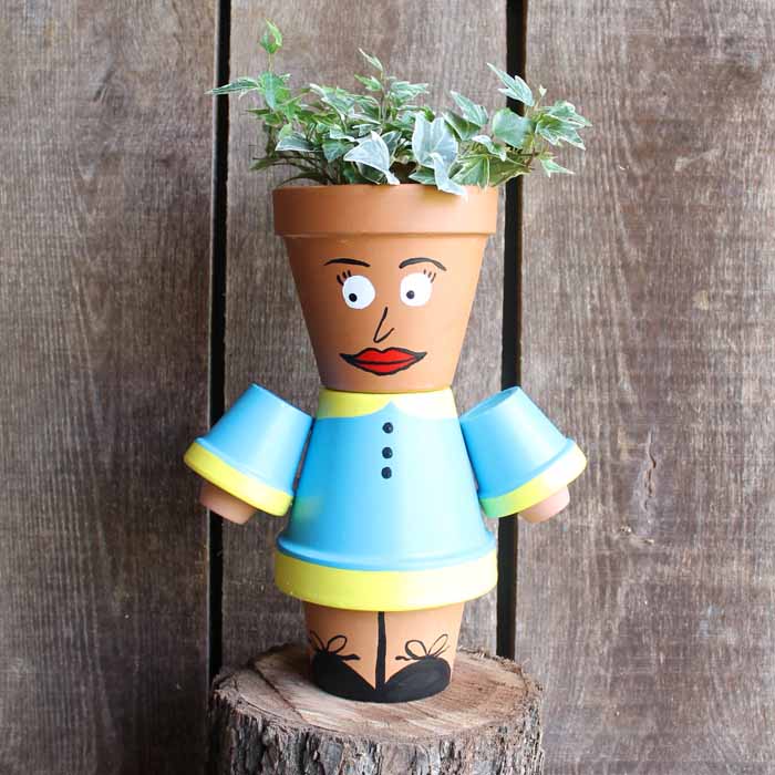 clay pot planter that looks like a person