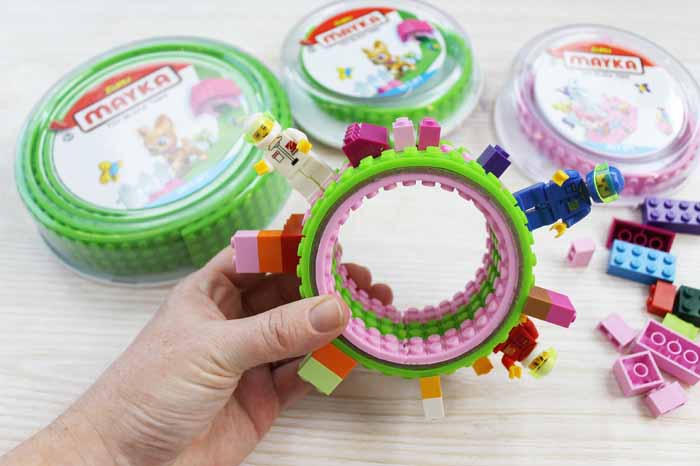 child holding a diy lego bracelet