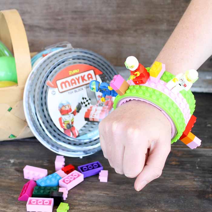 child wearing a lego bracelet made out of lego tape