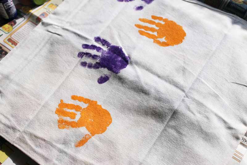 toddler handprints on a pillow cover