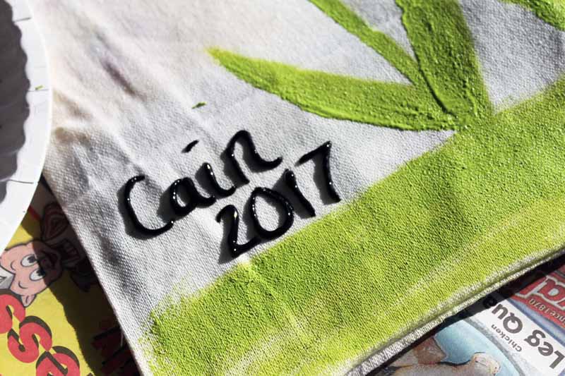 adding name and date to pillow cover in fabric paint