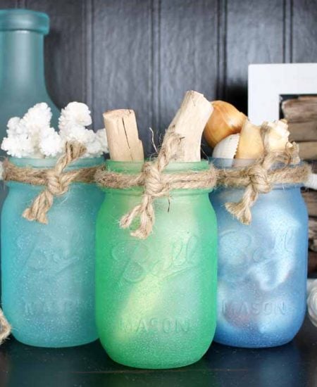 Painted mason jars with sea glass paint! A quick and easy project perfect for beach or nautical themed home decor!