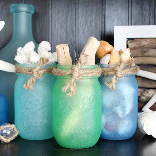 Painted mason jars with sea glass paint! A quick and easy project perfect for beach or nautical themed home decor!