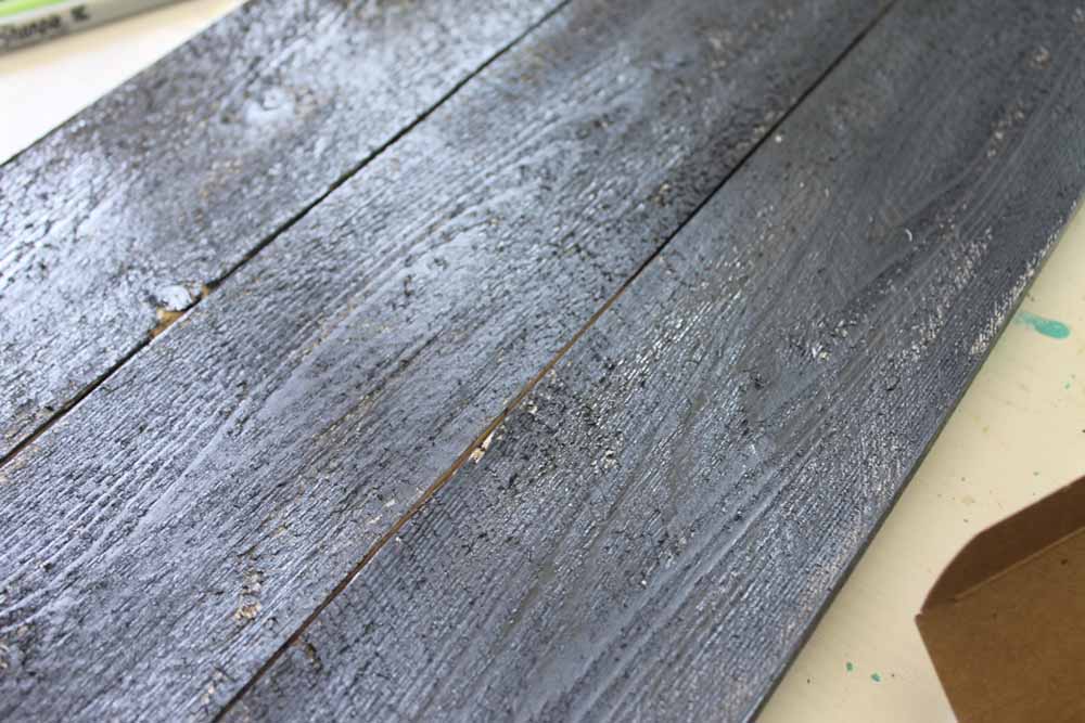 painting a rustic sign with grey paint