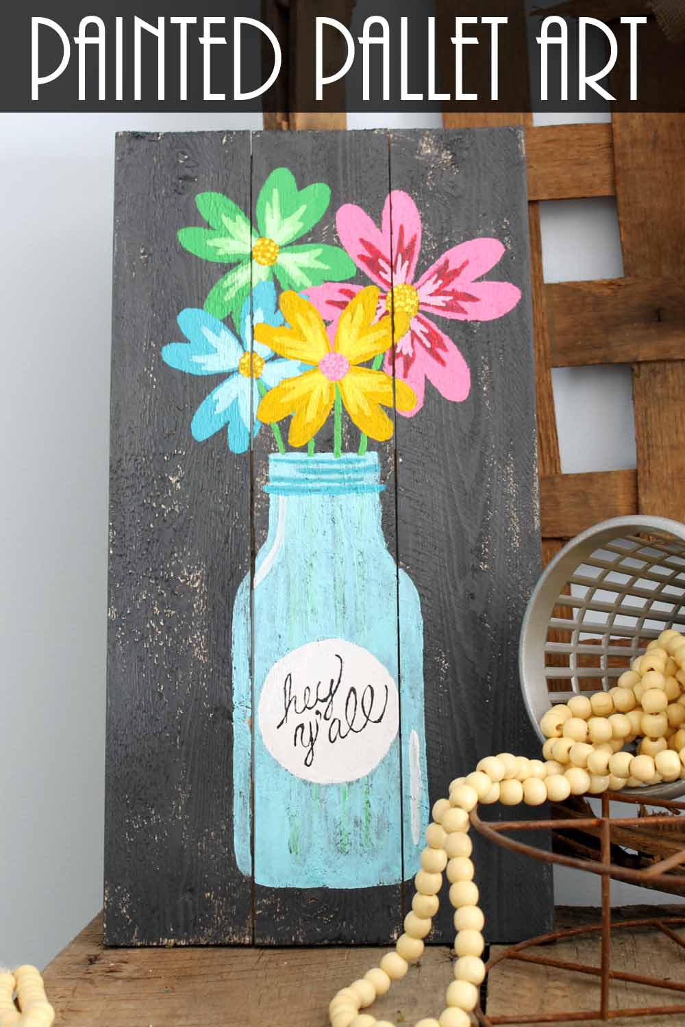 painted pallet art craft with a jar and flowers