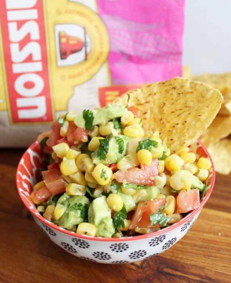 Make some sweet corn salsa with avocado! Serve this up for Cinco de Mayo with either chips or as a tasty topping for tacos! #recipe #cincodemayo #salsa #avocado