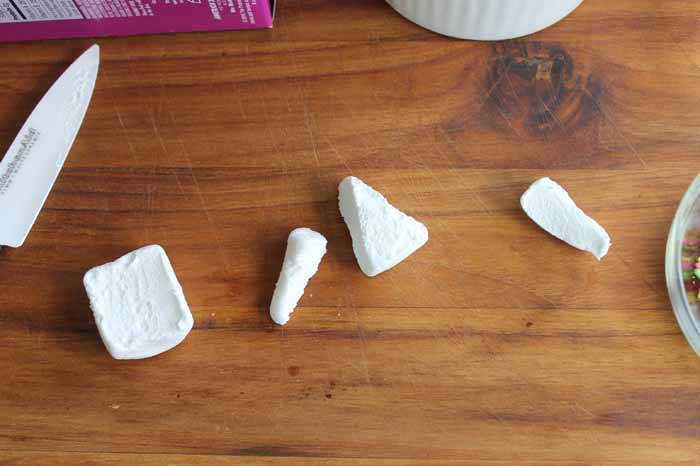 Cut the marshmallows into triangles--these will be the unicorn ears