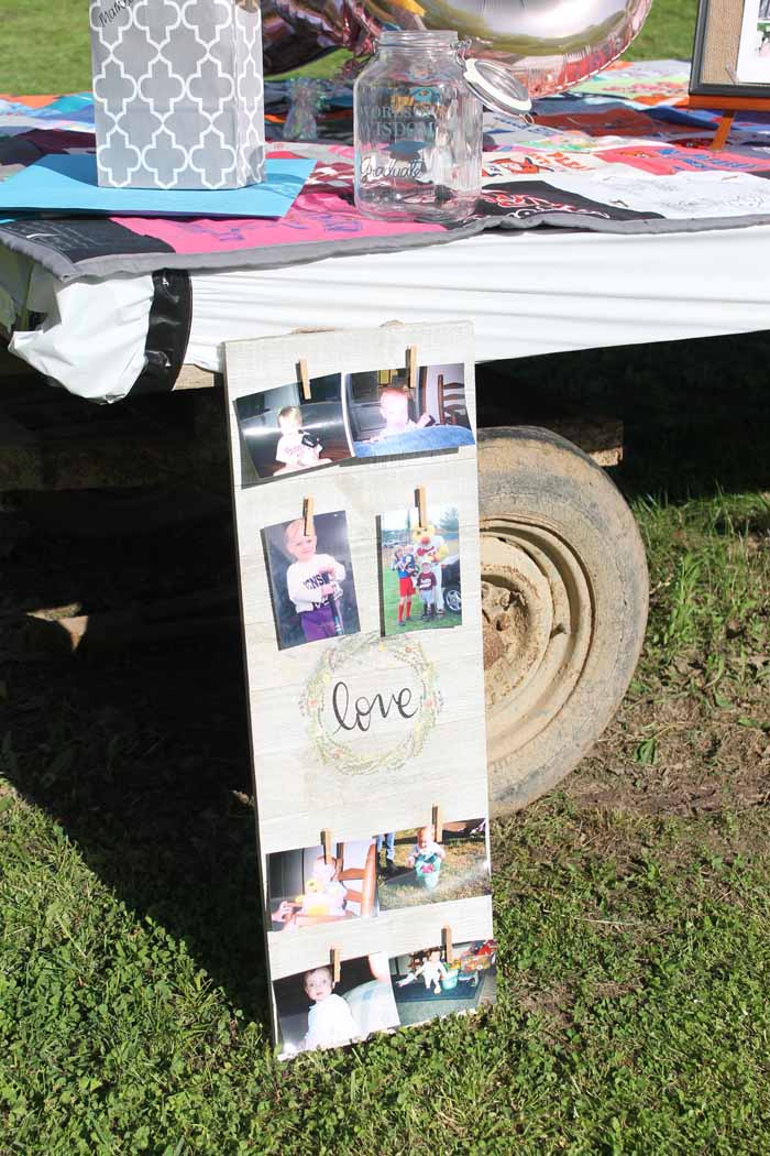 clothespin picture frame propped against wagon with pictures