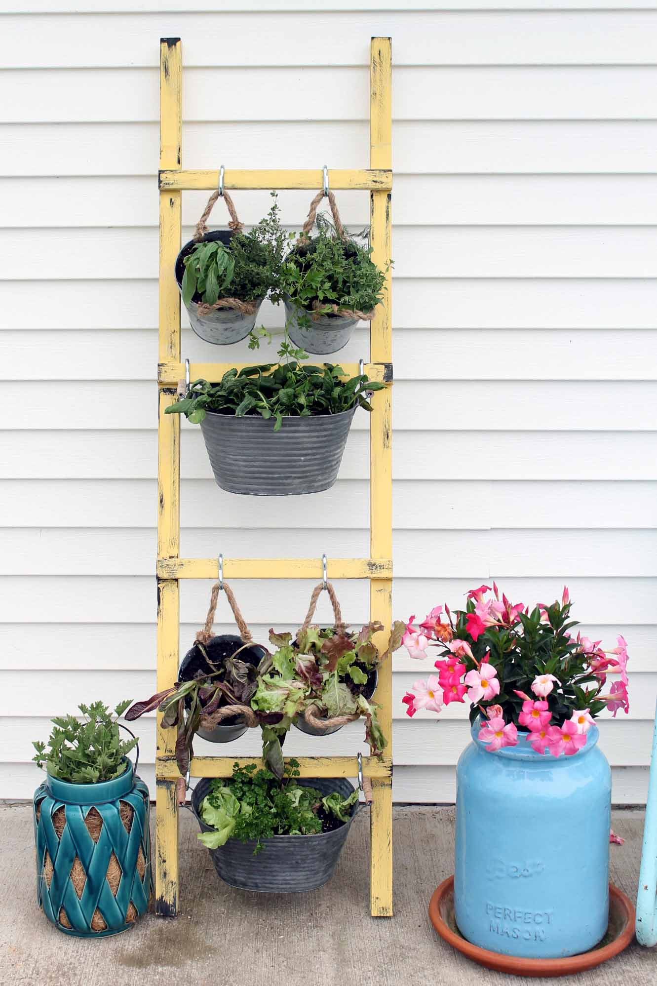 Add this DIY vertical garden to your porch this spring and summer! The perfect way to go vegetables and herbs in a small space!