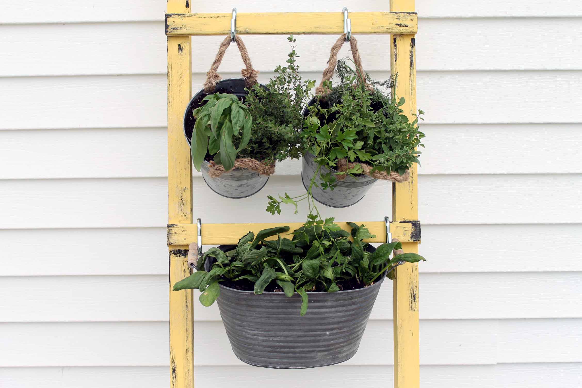 Add this DIY vertical garden to your porch this spring and summer! The perfect way to go vegetables and herbs in a small space!