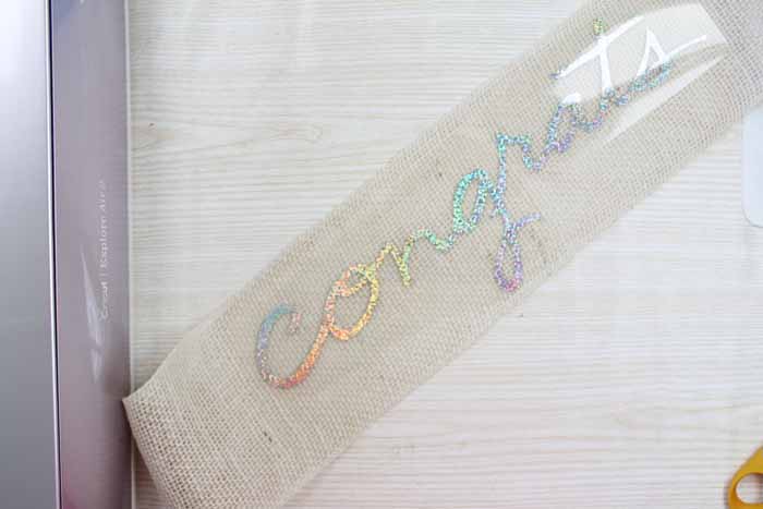 adding heat transfer vinyl to burlap ribbon