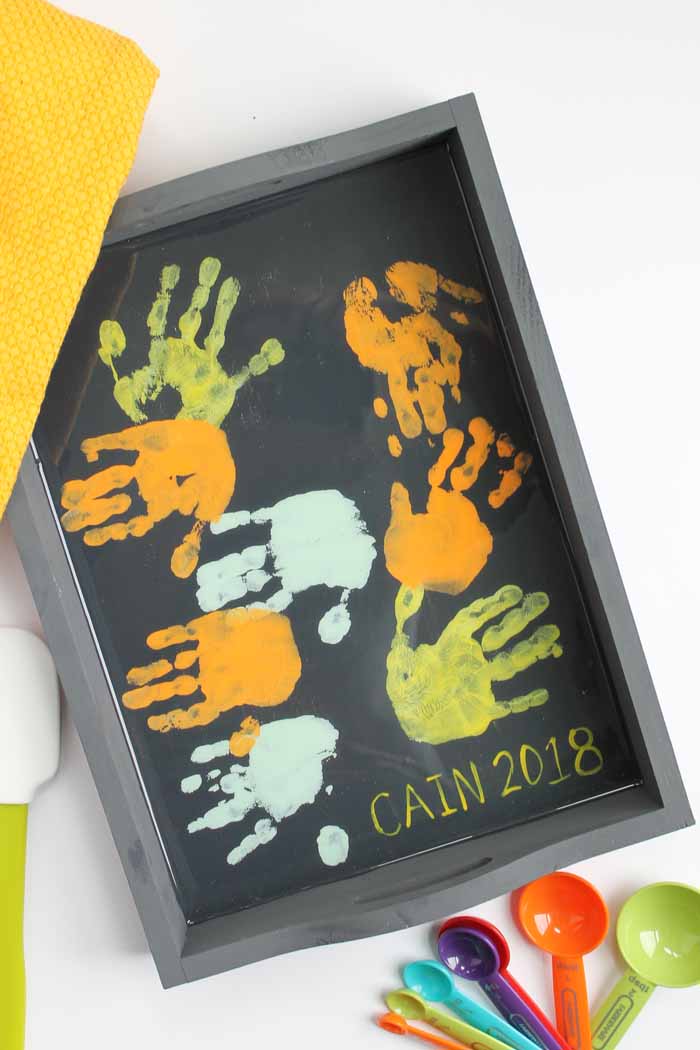 wooden tray with toddler handprints as a gift idea