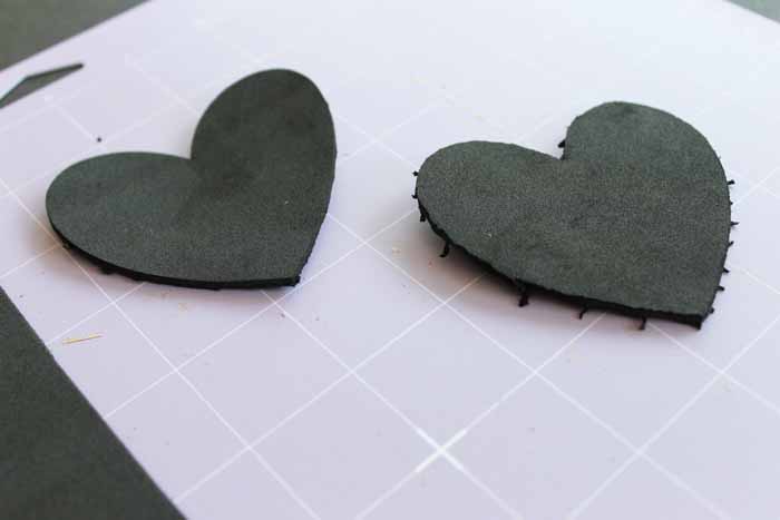 cricut mat with craft foam hearts on it