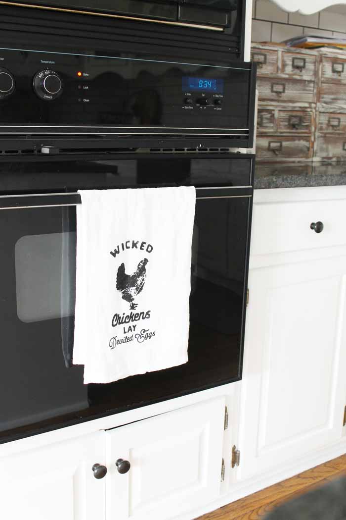 farm kitchen tea towel hanging on oven door