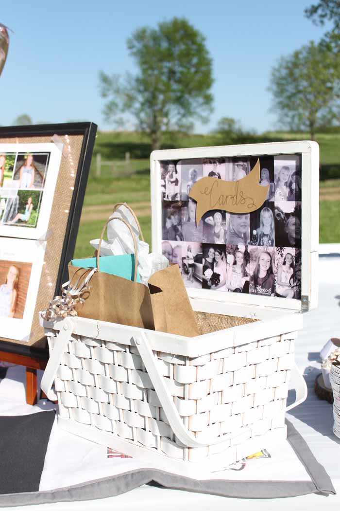 graduation party outdoors with a card basket on table