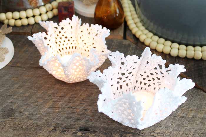 these cute doily candle holders are made with stiffened lace fabric 