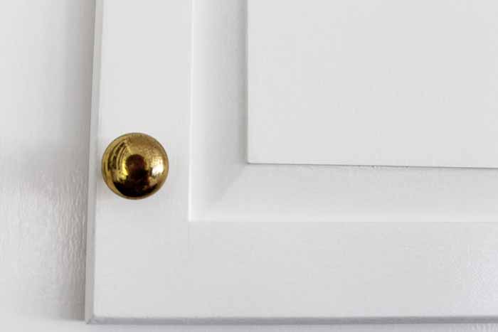 golden knob on cabinet