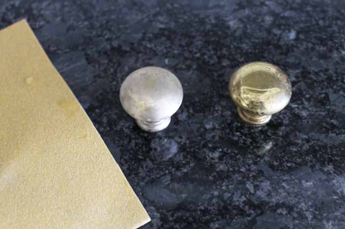 How to Paint Hardware one sanded knob next to golden knob