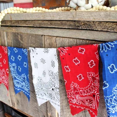 Add a patriotic bunting to your summer decor with bandanas! An easy DIY project that is perfect for 4th of July!