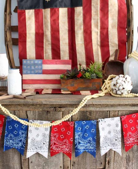 Add a patriotic bunting to your summer decor with bandanas! An easy DIY project that is perfect for 4th of July!