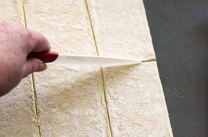 preparing puff pastry for cream cheese danish