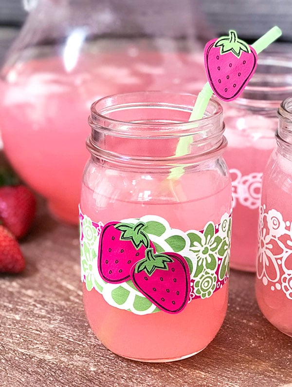 strawberry-decorated mason jar and straw for summer party