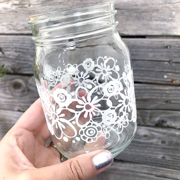Wrapping a mason jar with cut vinyl for parties! Easy to do with a Cricut cutting machine.