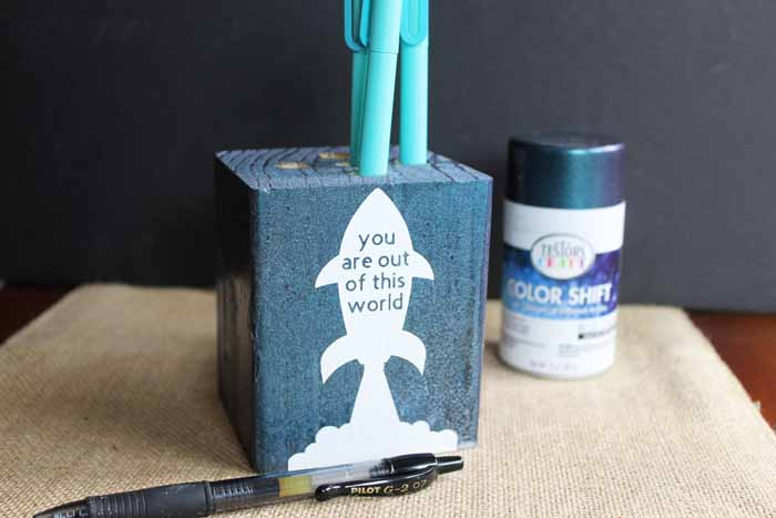 Make this wooden pencil holder for a great Father's Day gift that is easy to make and inexpensive as well! Use your Cricut machine to cut vinyl for the front and use Testors Color Shift paint to give a galaxy look to the entire thing!
