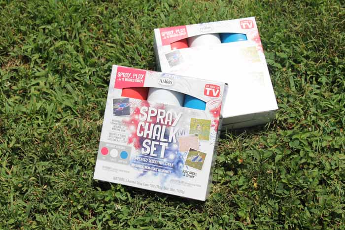 spray chalk in a box on the grass