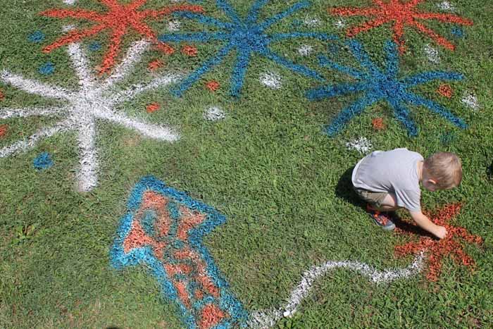 adding chalk spray paint to the grass