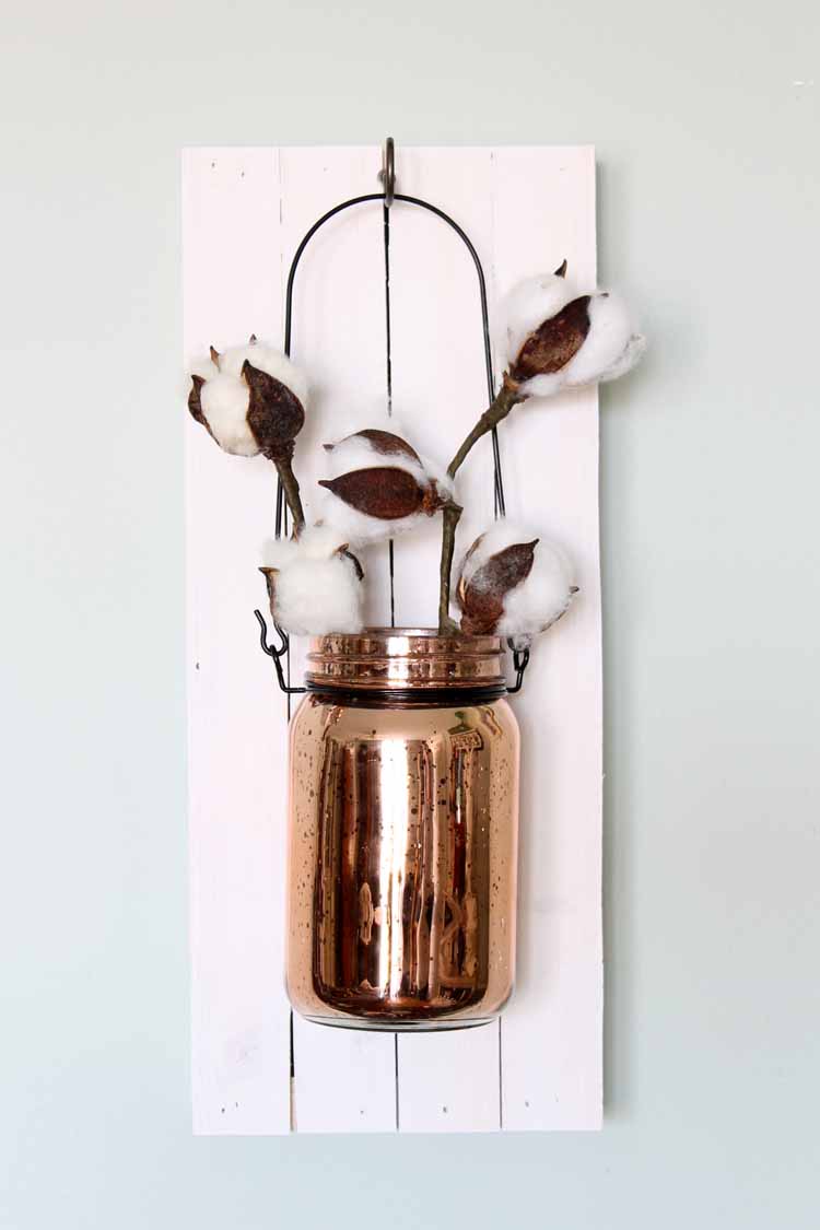 mason jar hanging on wood sign