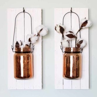 Make a mason jar on wood and add to your wall decor! A fun decorative idea for any farmhouse style home! And you have to love those copper jars and cotton branches!