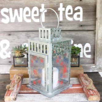 Make this patriotic candle holder from a lantern! Add a fireworks pattern to the sides for a fun Fourth of July decoration!