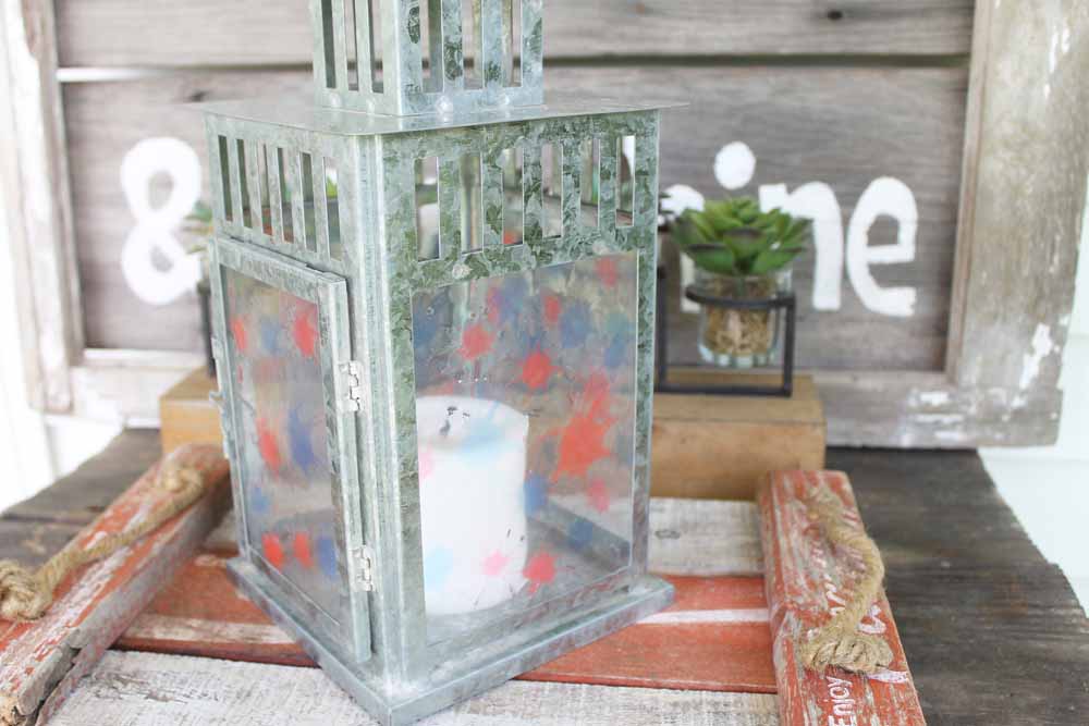 glass-paned lantern with patriotic candle