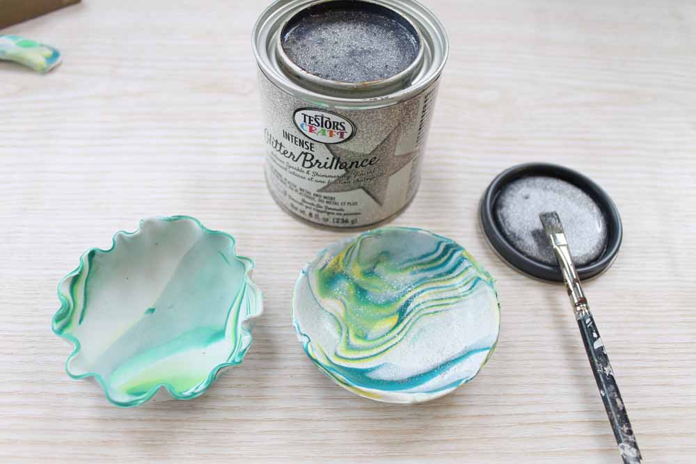 Once baked, coat the clay trinket dishes with glitter paint.