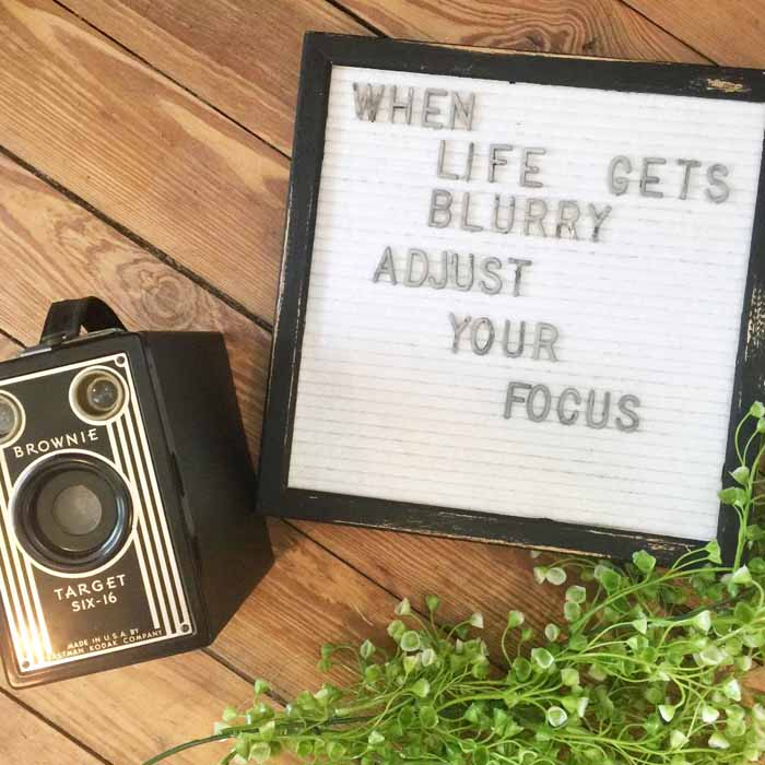 letterboard with a vintage camera 