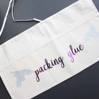 Make this DIY apron for crafting! Includes hot glue gun cut file!