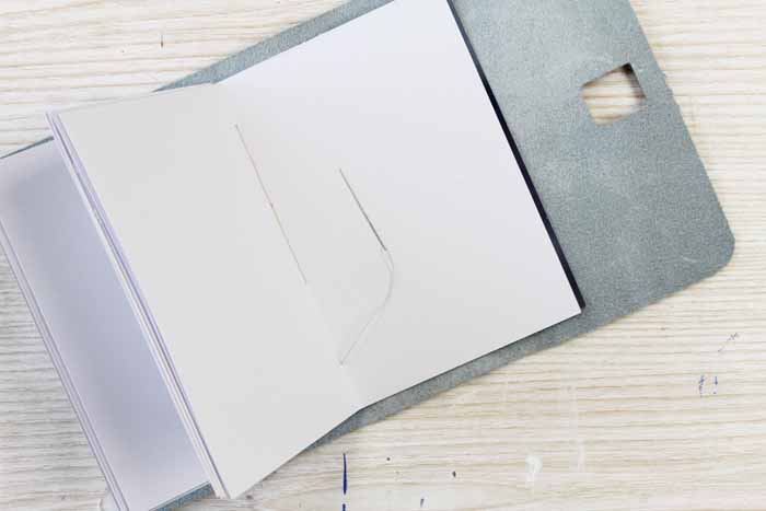 Continue attaching the paper for your notebook with thread
