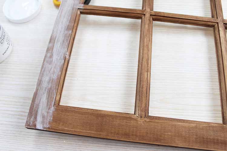 adding rustic paint to a wood window frame