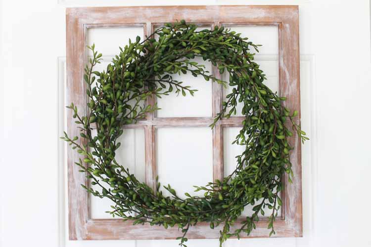 farmhouse window with a wreath